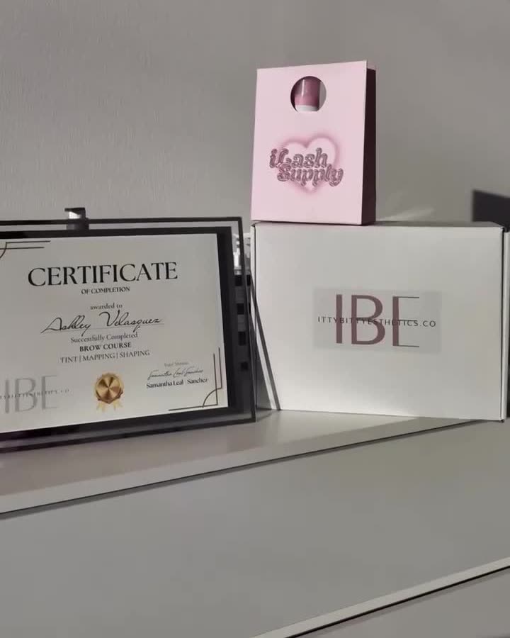 IBE certificate, iLash Supply bag and IBE box on the studio desk