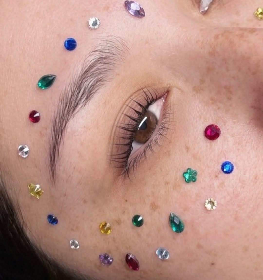 Brushed-up laminated brow framed with face gems