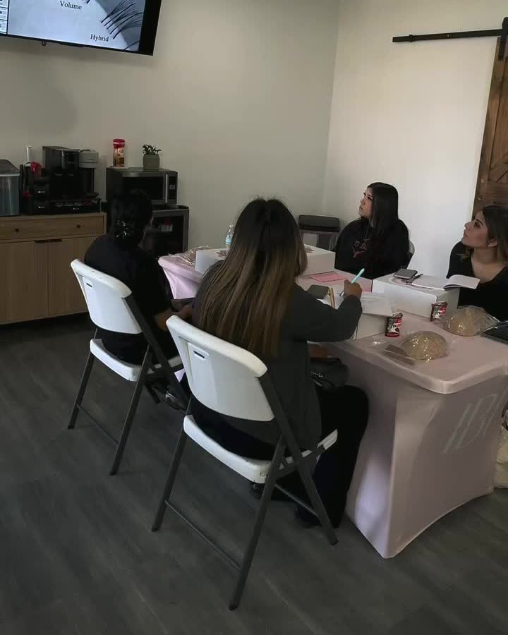Beginner lash course in session around the training table